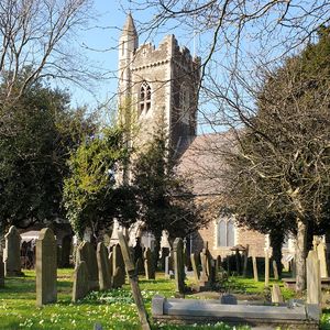 View of churchyard with church in background