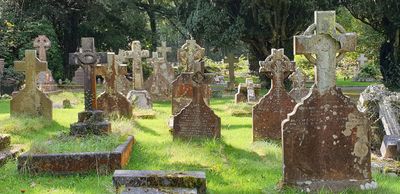Gravestones in the churchyard at St Matthew's church, Dyffryn, Neath