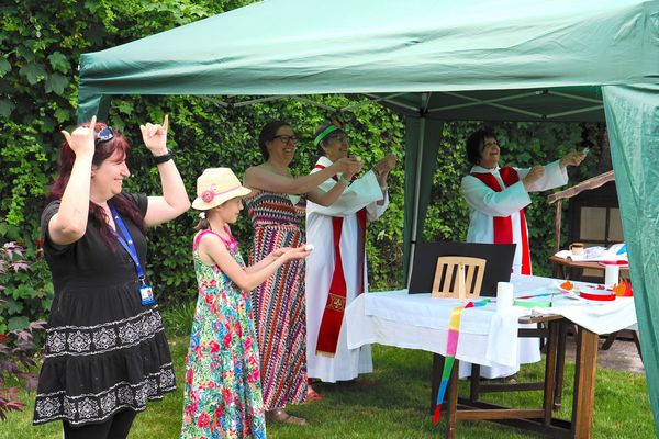 Nicola Roylance, our Deaf Community Engagement Officer, translating the God in the Garden Outdoor Eucharist into BSL