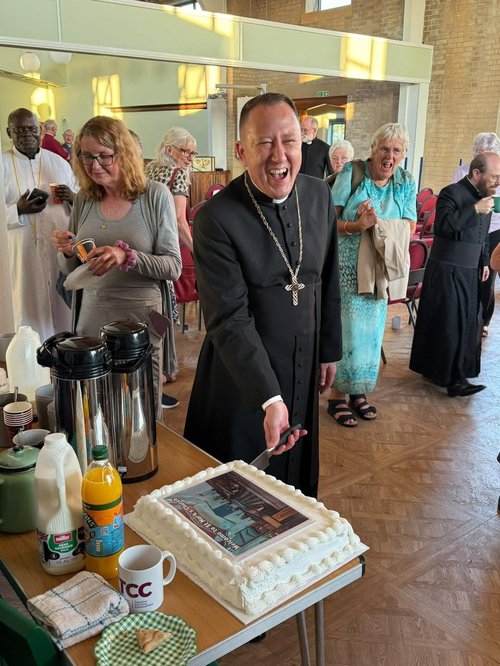 Fr-David-Morris-cutting-cake.jpg