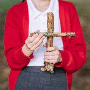 Girl holding cross