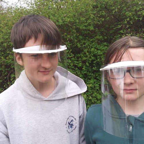 Joseph and Isaac with their face shields.jpg