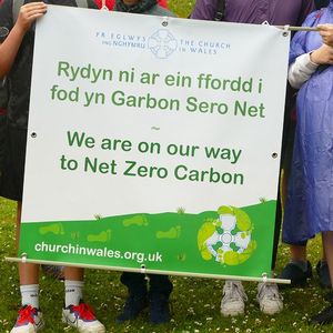 A net zero carbon banner during a protest in Swansea