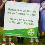 Launch of the Relay to COP26 from Swansea holding net zero carbon banner
