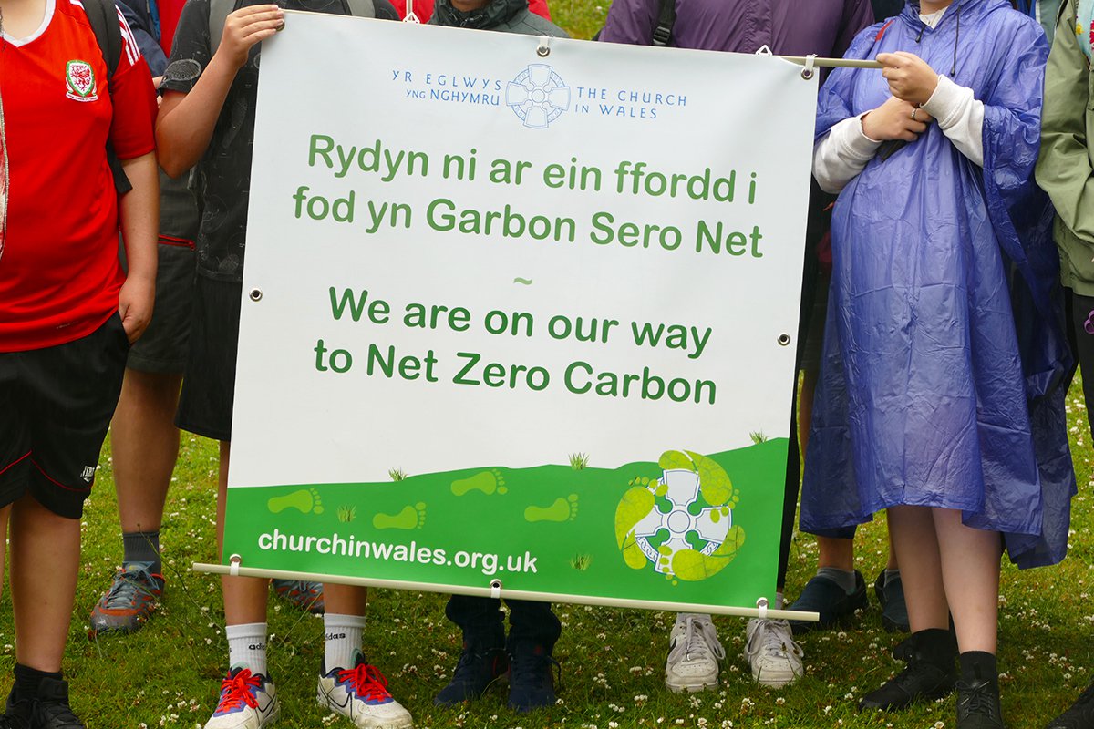 Launch of the Relay to COP26 from Swansea holding net zero carbon banner