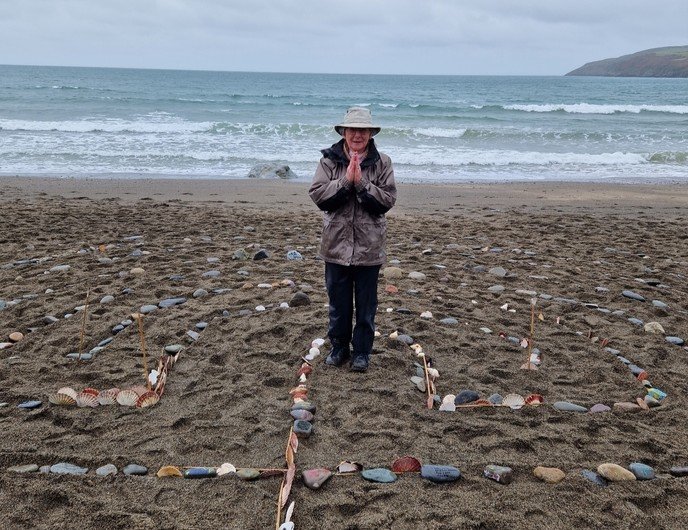Prayer stones returned to the sea at North Wales annual beach blessing.jpg