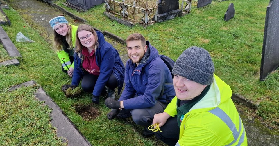 Refugees join biodiversity effort at Gwynedd churchyard