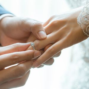 Couple exchanging rings