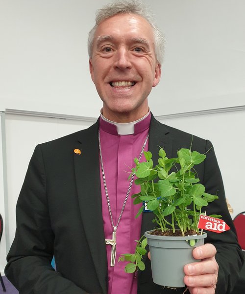 archbishop with christian aid peas.jpg