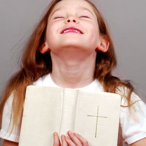 Girl holding Bible