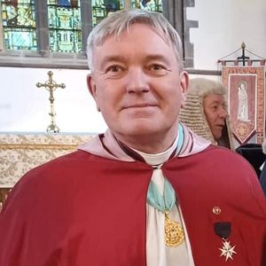 Reverend Stewart Lisk smiles at the camera