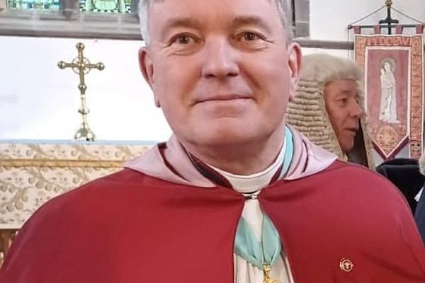 Reverend Stewart Lisk smiles at the camera